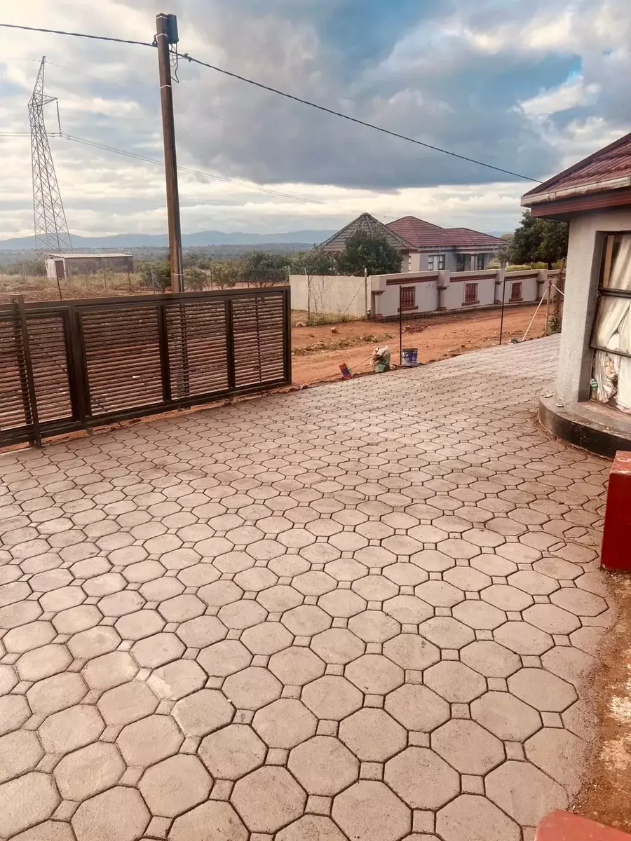 Interlocking paved driveway and yard