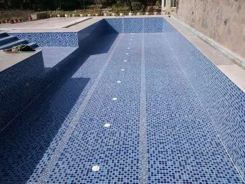 Empty swimming pool with blue mosaic tiles